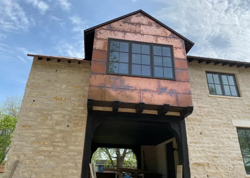 Copper metal panel facade on a stone building for Metal Roof Coating in Wayne